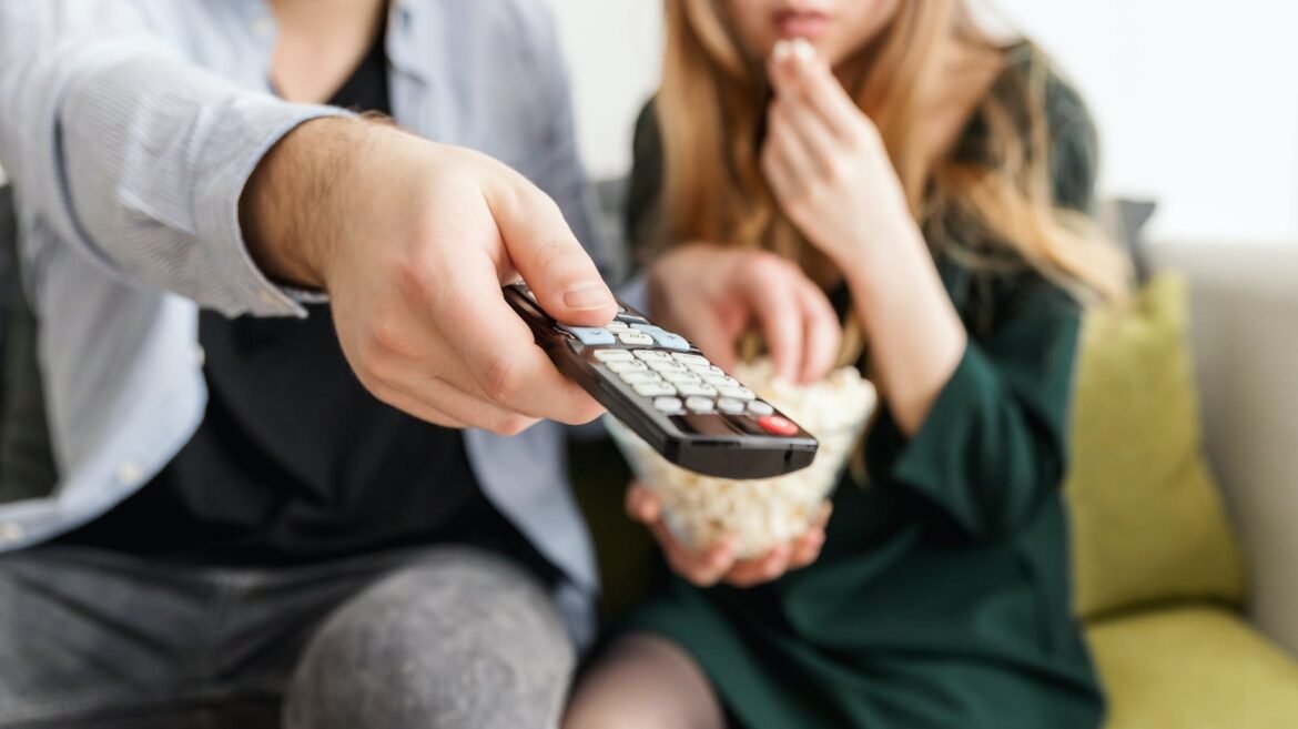 man holding remote control