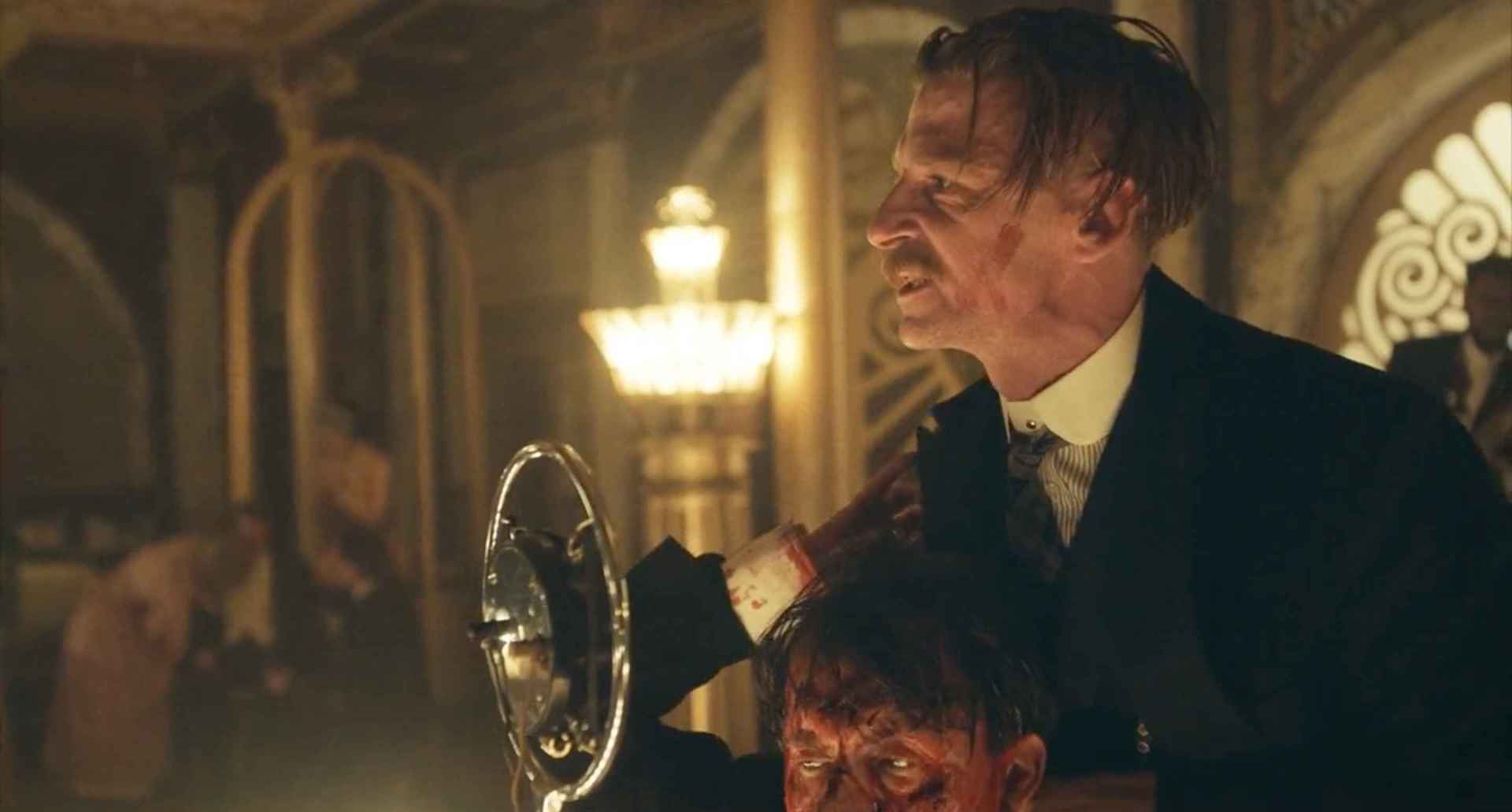 Peaky Blinders Arthur Shelby stabs a man and holds him up