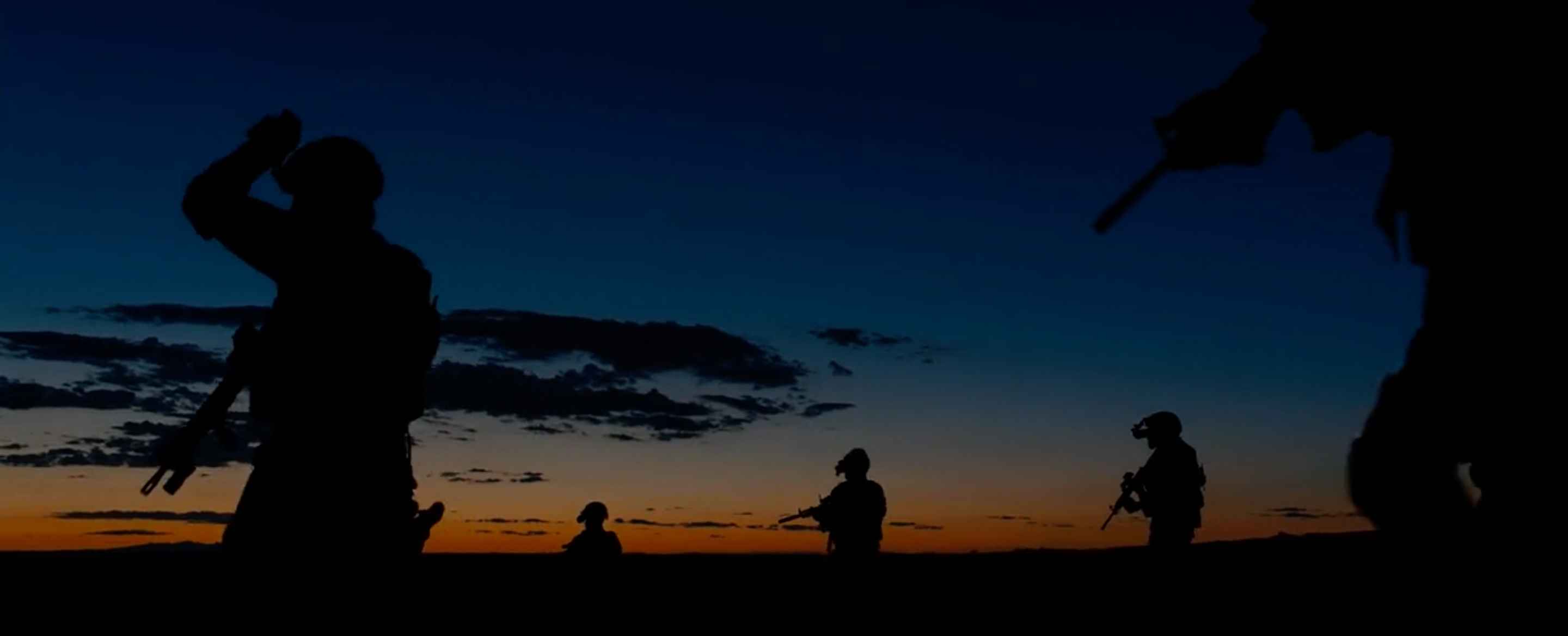 Sicario - Task move into positions with the sunset in the background
