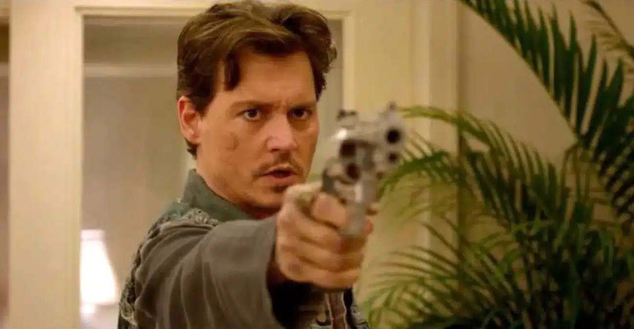 Top 10 Movies Like 21 Jump Street - Jonny Dept holding a gun