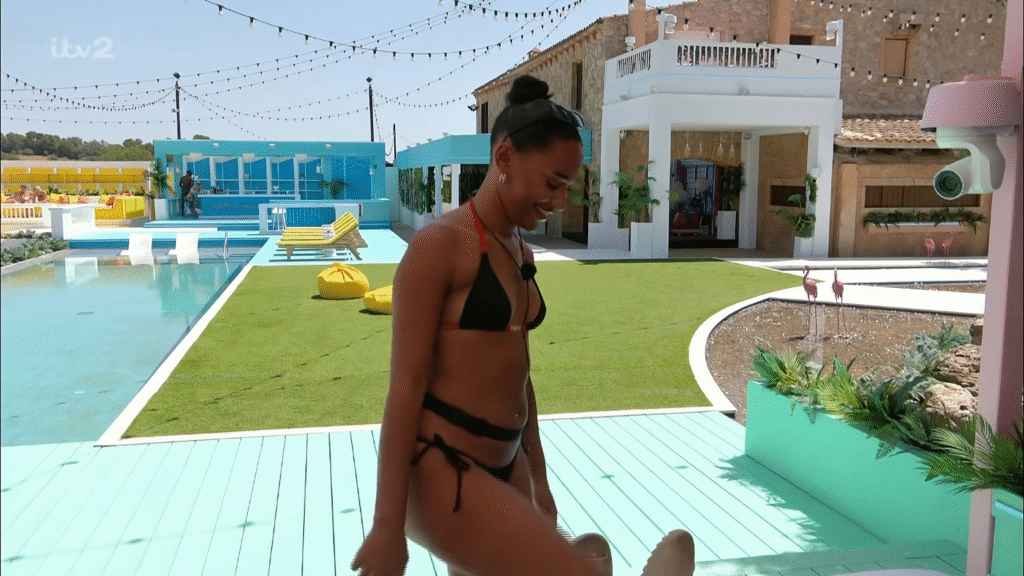 Love Island Star Jessica Spencer with her leg up in black bikini