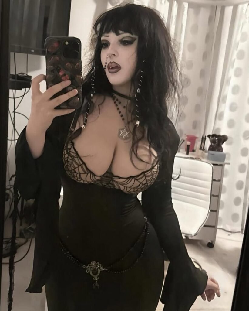 Ghoulishbats wearing black dress and star of David