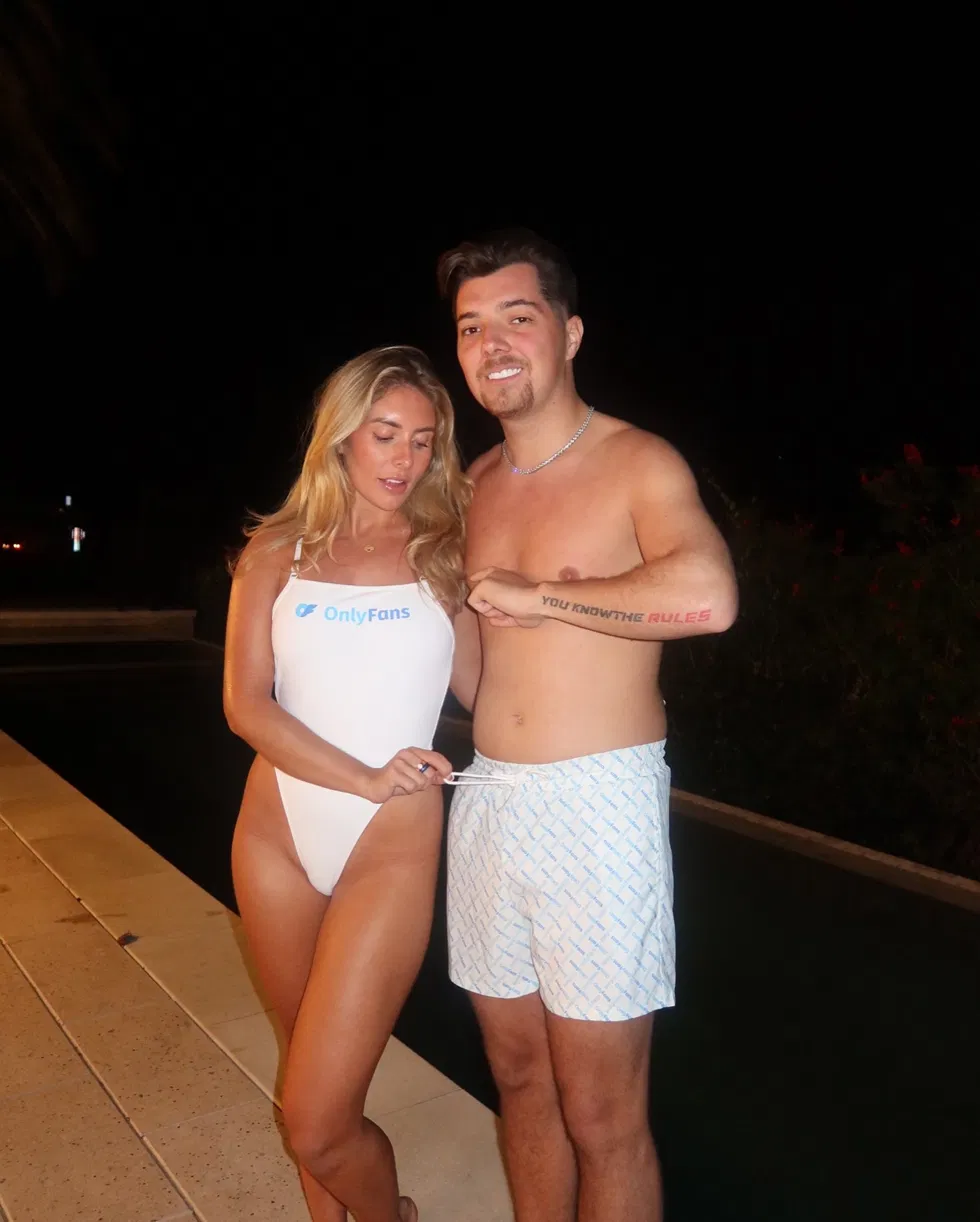 Bonnie Blue in white OnlyFans swimsuit with Beavo poolside at night