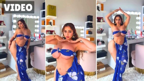 Ms Sethii posing in blue floral bandeau and wrap skirt in her makeup room