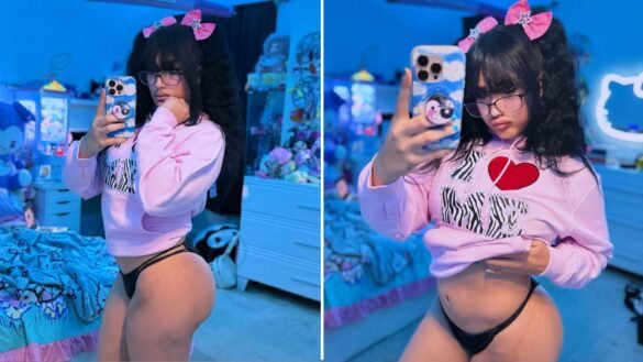 Two mirror selfies of Lord Len in glasses, pink bows and a pink I Love Me hoodie in her Hello Kitty-themed bedroom